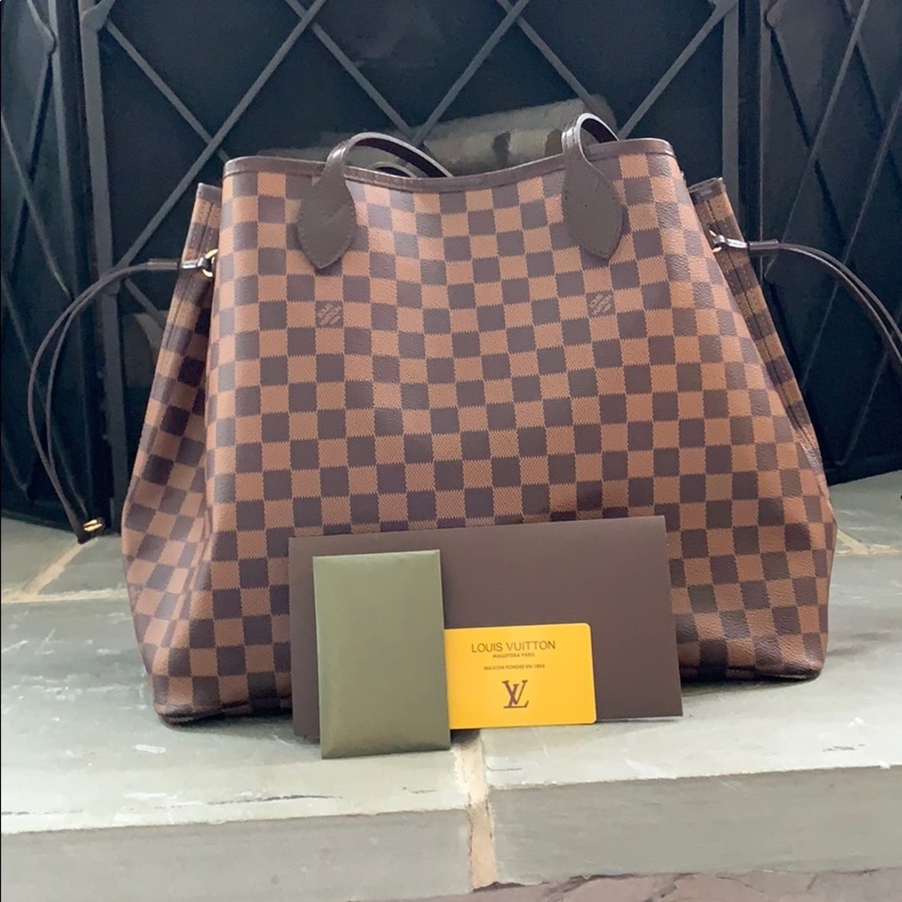Authentic New GM NF LV w/pouch included